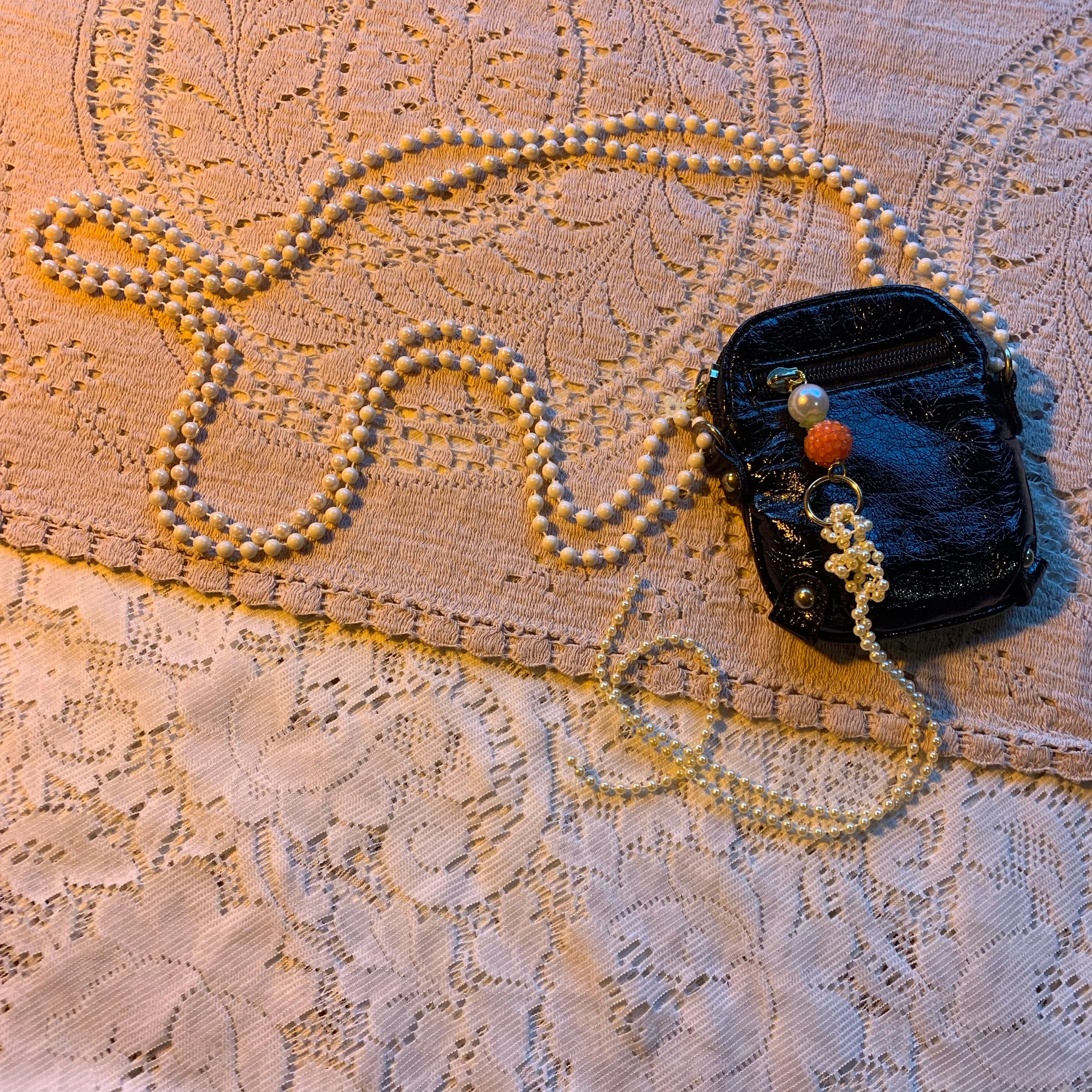 Patent pearl charm bag